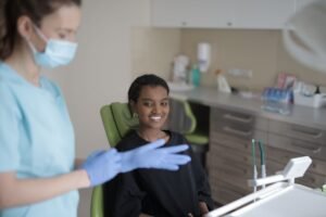 Dentist explains in-network vs out-of-network dental insurance coverage to a patient at a dental clinic in Elk Grove, CA